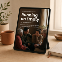 Running on Empty digital caregiver resilience guide displayed on a tablet in a warm home-office setting.
